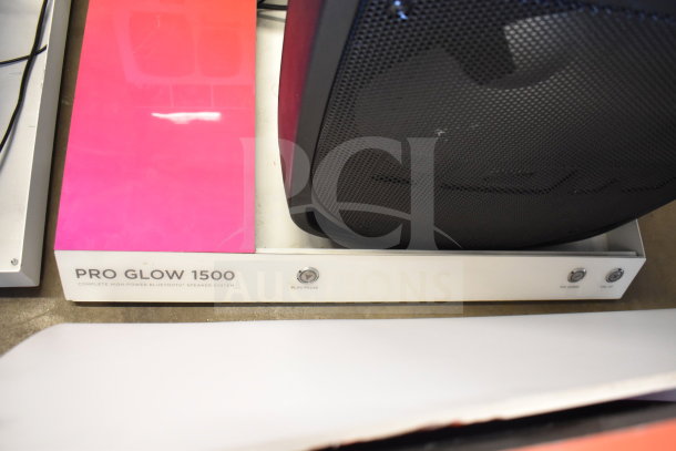 Store display featuring Ion Pro Glow 1500 speaker, high-power Bluetooth system, play/pause and volume controls, excellent condition.