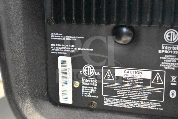 Ion Pro Glow 1500 Speaker label close-up showing model number, FCC ID, caution warning, and compliance logos.