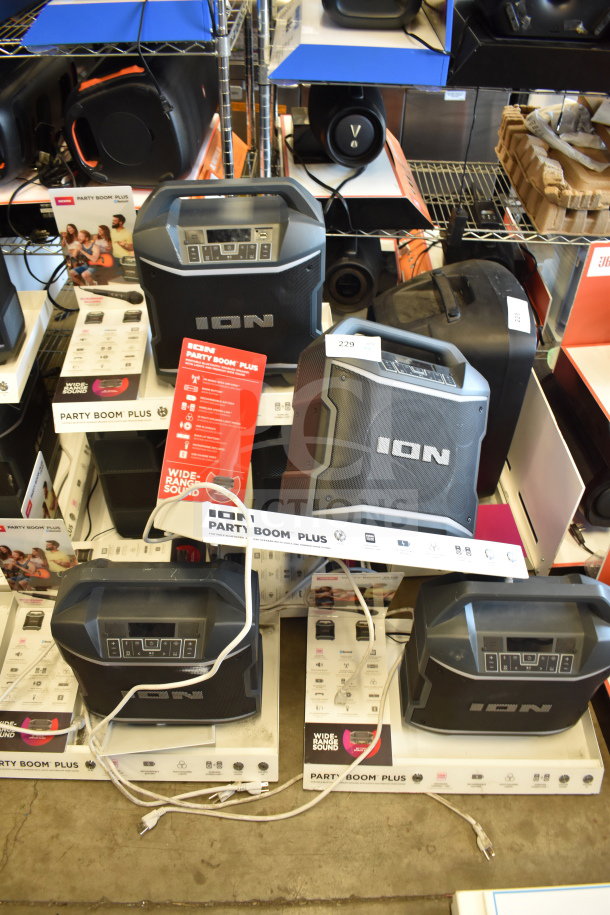 6 Ion Party Boom Plus speakers on display, each in new condition. Featured with control panels, handles, and original packaging.