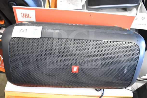 JBL Partybox 110 Portable Bluetooth Speaker, store display model. Features black mesh grille, JBL logo. Visible wear on top.