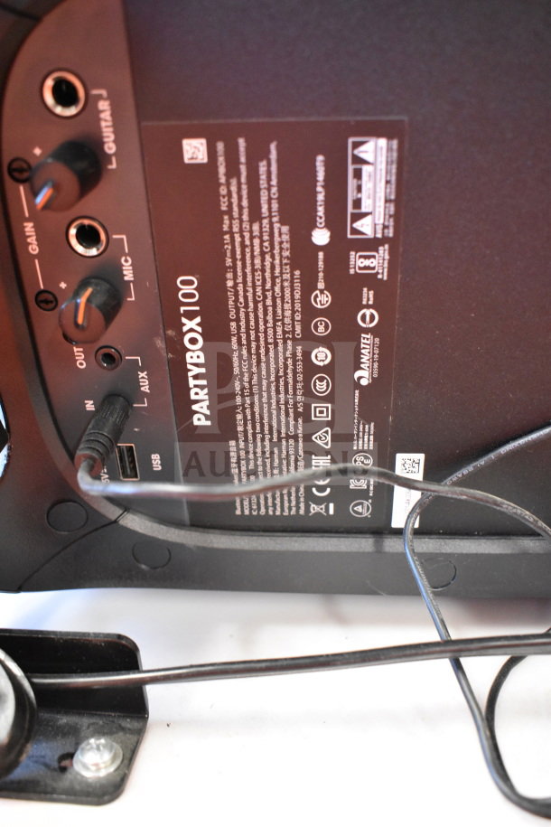 JBL Partybox 110 Portable Bluetooth Speaker, control panel view. Features AUX, USB, and MIC inputs. Model label visible.