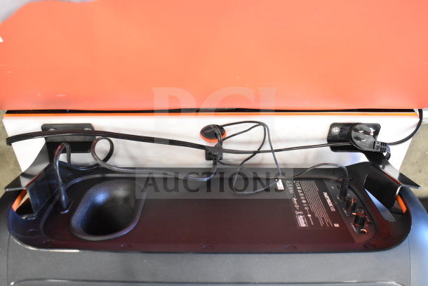 6-store display with JBL Partybox 110 Portable Bluetooth Party Speaker, visible wiring, and control panel.