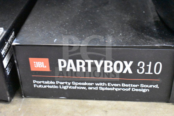 JBL Partybox 310 speaker in original packaging, features portable design, futuristic lightshow, and splashproof exterior.