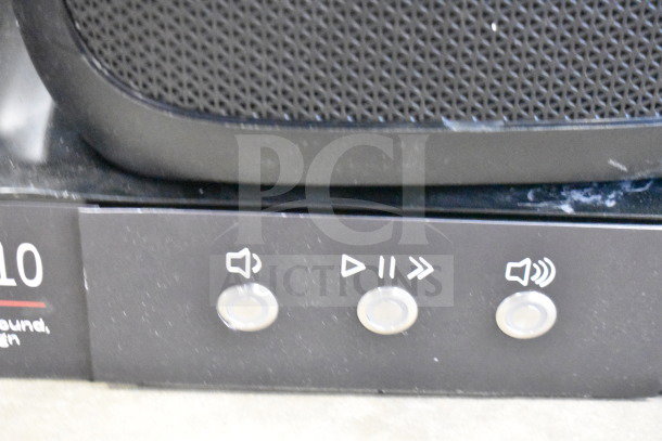 JBL Partybox 310 speaker on a store display, showing control buttons. Slight surface wear visible.