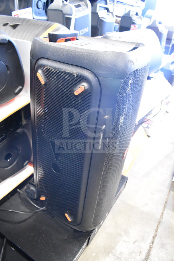 JBL Partybox 310 speaker, black, lightly used, with visible handle and control panel, displayed in store.