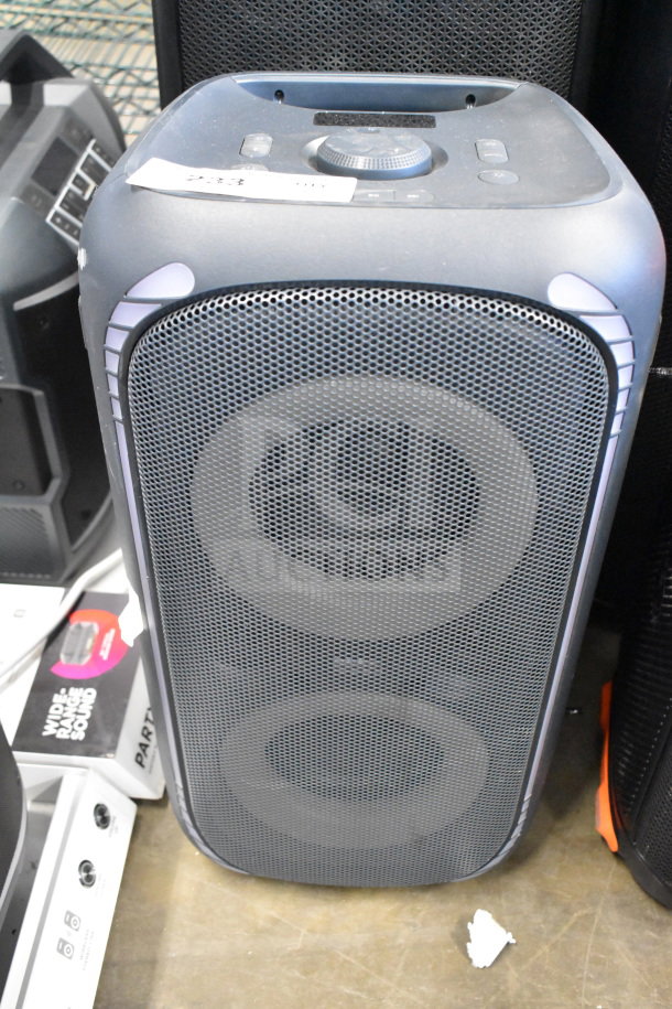 JBL speaker with dual drivers, black mesh grille, control panel on top, in good condition.