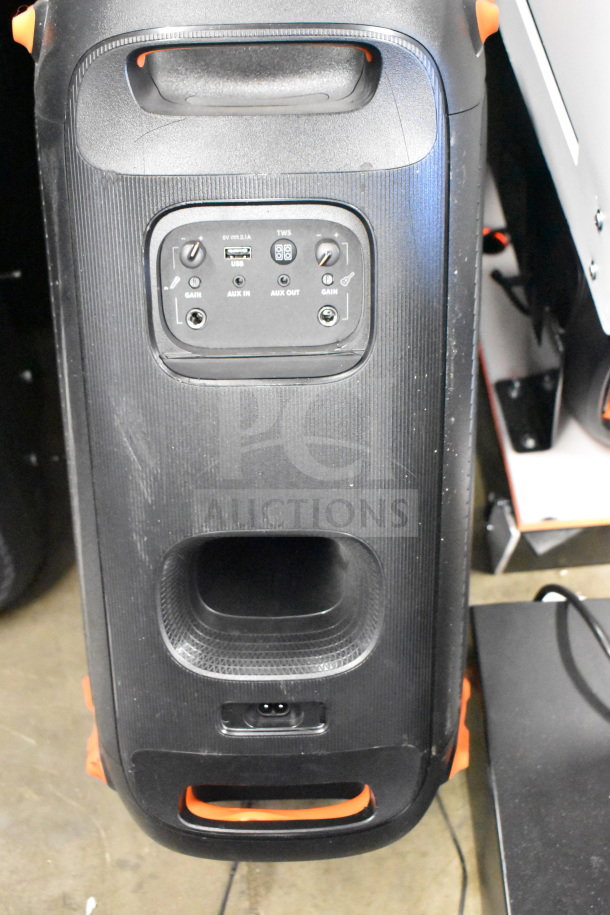 Black JBL speaker with control panel showing gain knobs, USB, AUX in/out ports; sturdy condition.