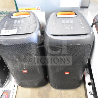 Two JBL Partybox 310 speakers, portable with built-in controls, showing signs of use.