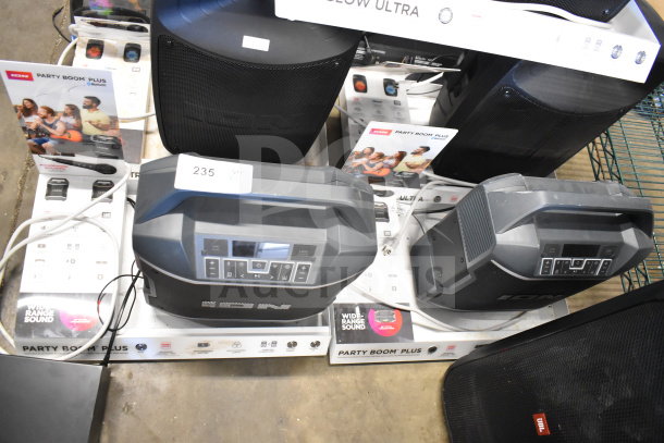 Ion Party Boom Plus Speakers on store display, featuring versatile connectivity, wide-range sound, and Bluetooth capabilities.