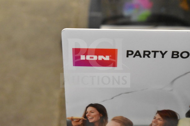 ION Party Boom Plus Speaker store display, featuring brand logo and partial group image on a white background.