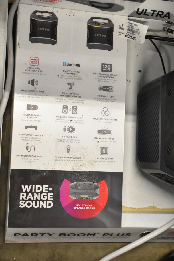 Ion Party Boom Plus Speaker display. Features include Bluetooth 5.2, 120W sound, USB playback, and multi-colored lights. Tags show model details.
