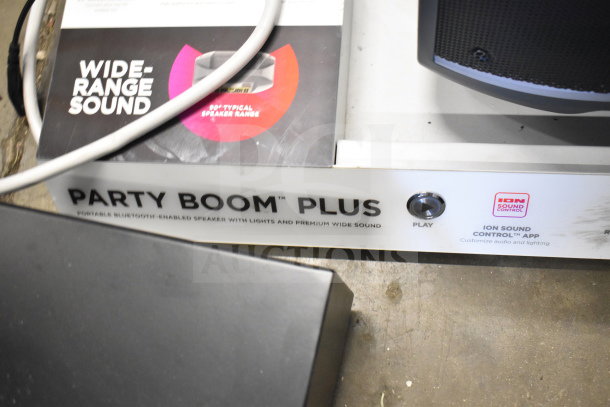 Ion Party Boom Plus speaker display, highlighting wide-range sound and control app, in good condition.