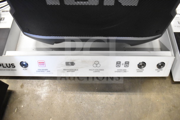 2 Ion Party Boom Plus speakers on store display; features include rechargeable battery, multi-colored lights, and wireless stereo link.