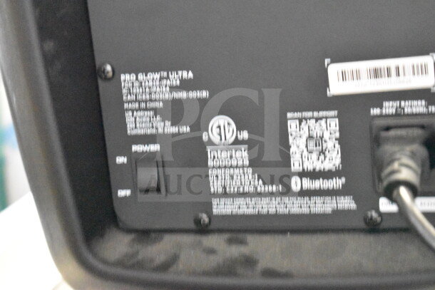 Ion Pro Glow Ultra speaker back panel with power switch, QR code, and Bluetooth logo. Model details are visible.
