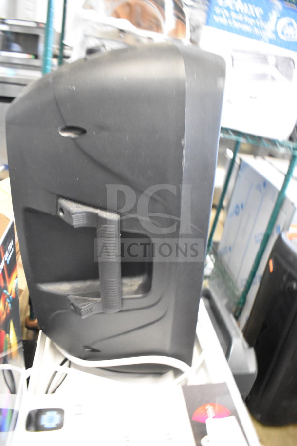 Ion Pro Glow Ultra speaker on display, black casing, ergonomic handle, visible controls, used condition, ideal for events.