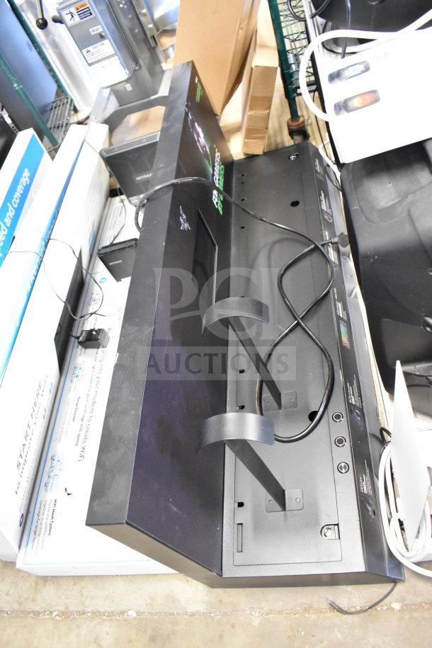 Store display unit featuring five sections, cables attached, in used condition. Ideal for showcasing products.