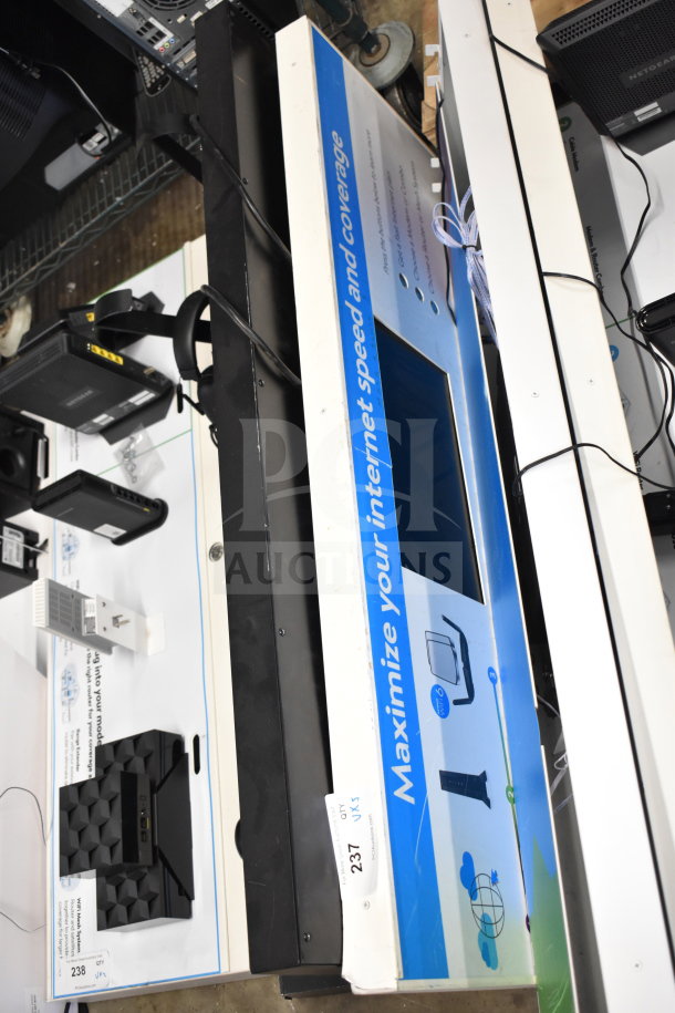 Store display board promoting internet speed optimization; features a blue and white theme. Condition appears used.