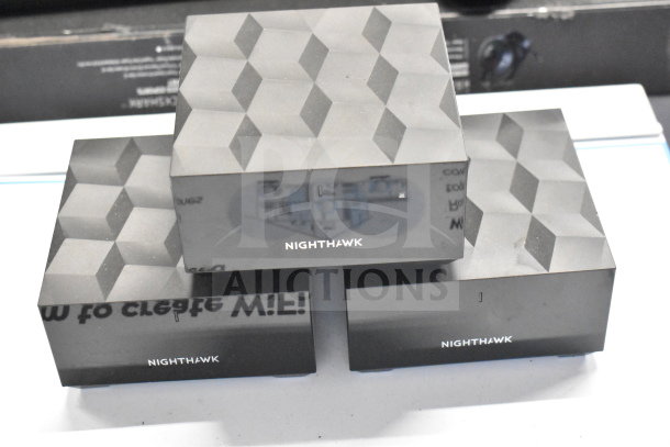 Nighthawk routers with geometric design, excellent condition, perfect for enhancing wireless connectivity.
