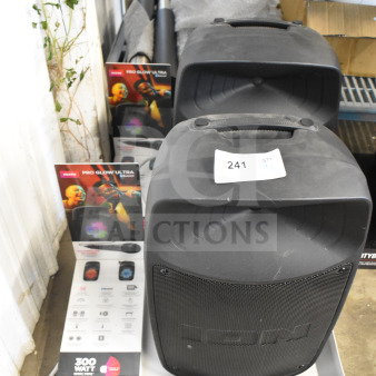 2 Ion Pro Glow Ultra speakers on store display, 300W audio, in good condition, with promotional stand and tag labeled "241 qty x2."