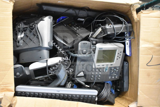 Lot of various corded office telephones, Logi keyboard, and a credit card reader in a box. Mixed condition.