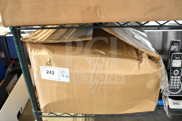 Box containing a lot of various corded office telephones, a keyboard, and a credit card reader. Box is slightly damaged. Auction tag 242 visible.