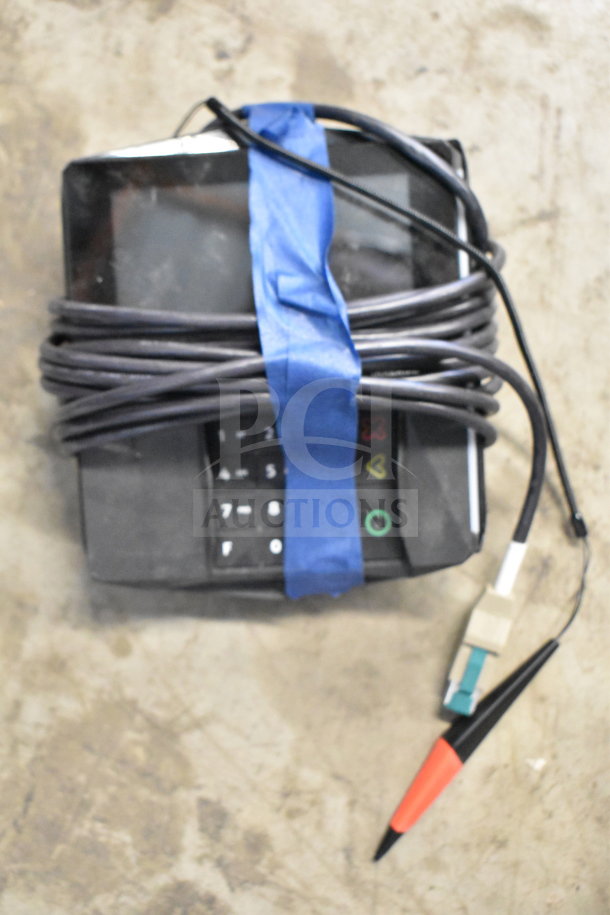 Lot of corded office telephones, keyboard, and credit card reader with cables wrapped in blue tape; used condition.