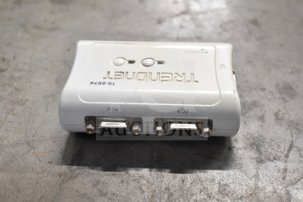 Alt text: TRENDnet TK-207K KVM switch with two VGA ports, white, used condition, visible wear.