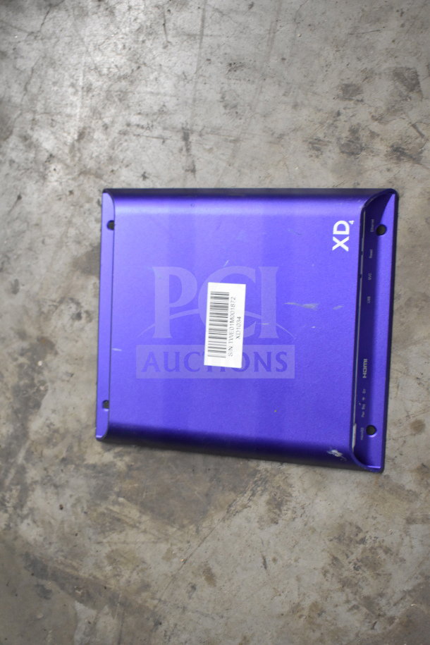 Blue XD case with HDMI port, minor scratches; part of auction lot including phones, keyboard, credit card reader.