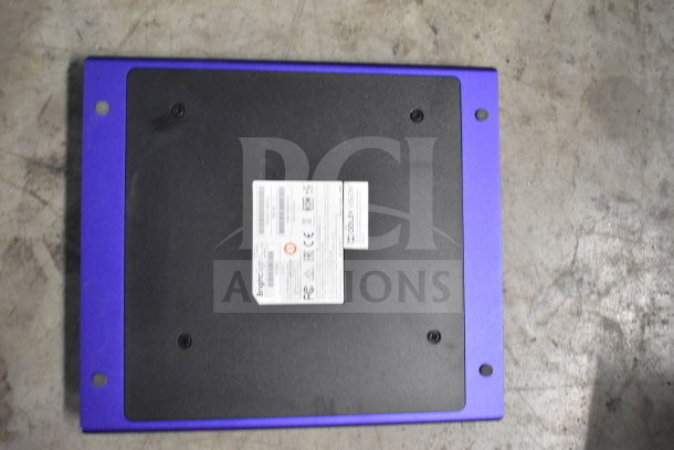 Square sympOS box with black center and blue border, featuring a label with FCC compliance and technical details.