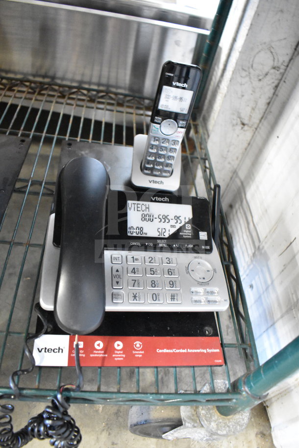 VTech cordless/corded answering system with digital display and handset. Features caller ID, volume control, and answering machine.