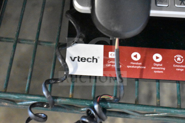 VTech store display with telephones featuring caller ID, handset speakerphone, digital answering system, extended range.