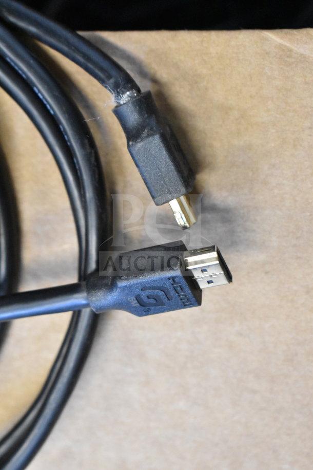 Lot of HDMI cables, black, varying lengths, with standard gold-plated connectors. Good condition, some wear visible.