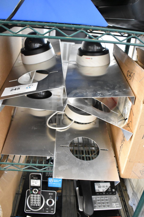 6 Bosch dome security cameras, new condition, with mounting plates; lot includes camera quantity tag.