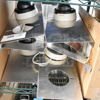 6 Bosch dome security cameras, new condition, with mounting plates; lot includes camera quantity tag.