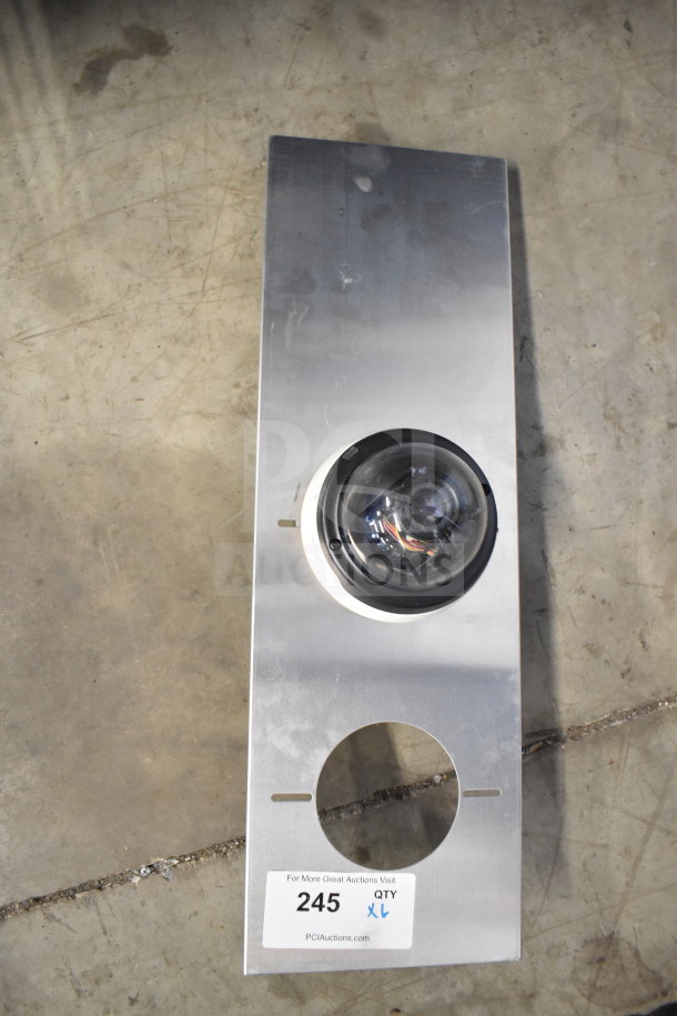 Bosch dome security camera, mounted on metal plate. Item tag reads "245 QTY XL" for online auction.