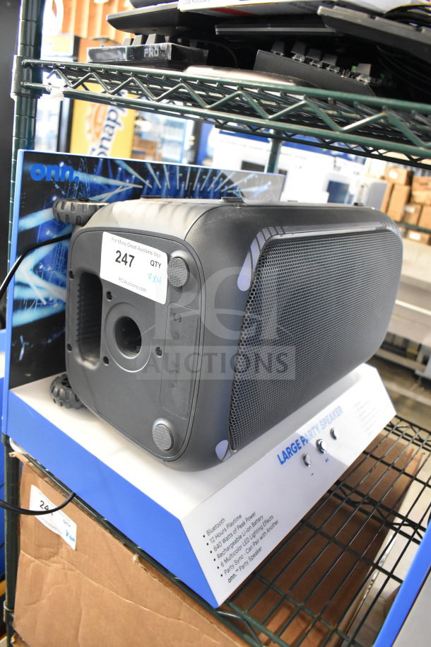 Onn large party speaker display, black, with Bluetooth, 12-hour playtime, and LED lighting effects; includes Samsung speakers.