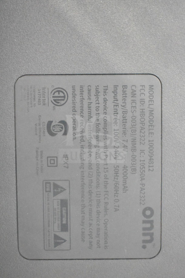 Label on onn speaker model 100094812, 7.4V, 4000mAh, IPX7, FCC ID: HBOPA2322, describing compliance and safety info.