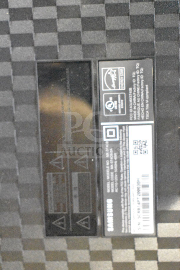 Onn store display speaker and Samsung speaker labeling. Samsung logo, QR code, and energy efficiency certifications visible.