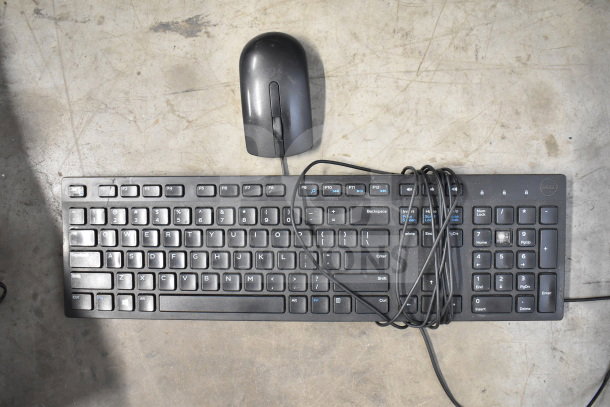 Dell keyboard and wired mouse on concrete surface, part of a lot with 20 tech items including a Netgear router.