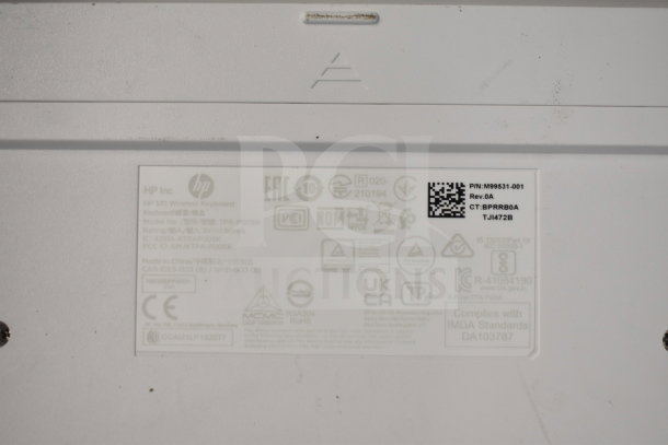 HP 510 Wireless Keyboard label showing product specifications, serial number, regulatory logos, and compliance standards.