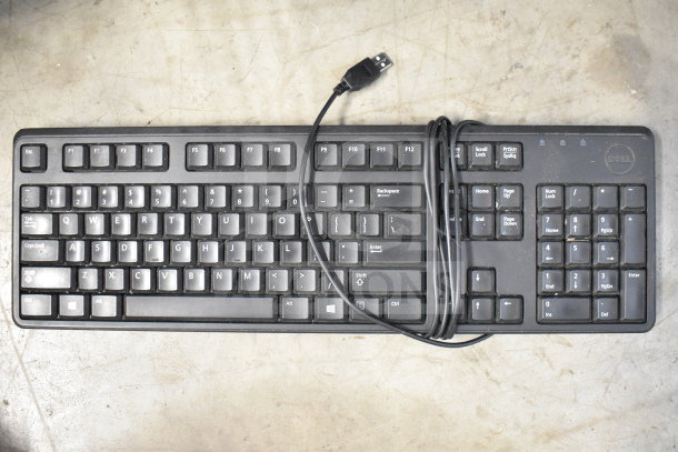 Dell wired keyboard with USB connection, black, visible wear on keys, part of a lot of 20 computer items including a router.