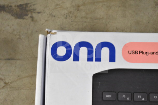 Box with "onn" logo, showing corner damage. USB plug-and-play keyboard packaging.