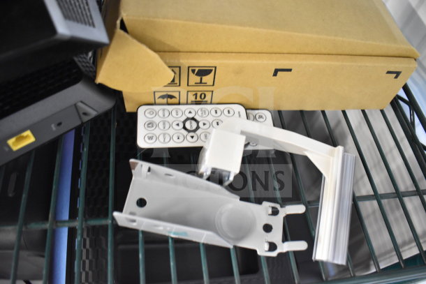 Various electronics including a Netgear router, remote control, and wall mount bracket on a shelf. Box with icons visible.