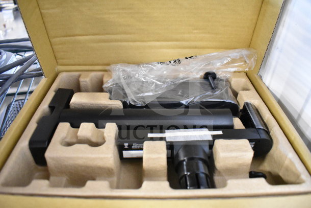 Assorted tech items in box, including a router, keyboards, and mice. New condition, packed with protective insert.
