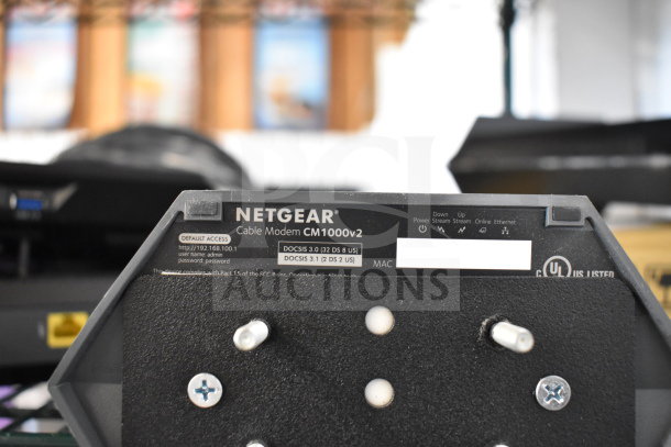 Netgear Cable Modem CM1000v2, DOCSIS 3.1 support, part of a lot with keyboards and mice, 20 items total.