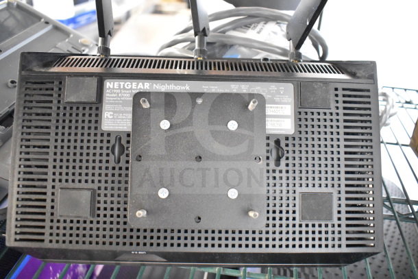 Netgear Nighthawk AC1900 WiFi Router, Model R7000, shown from the bottom with visible labels and antennas.