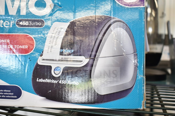 Dymo LabelWriter 450 Turbo in worn box. High-speed label printer, ideal for office use. Visible paper label print demo.
