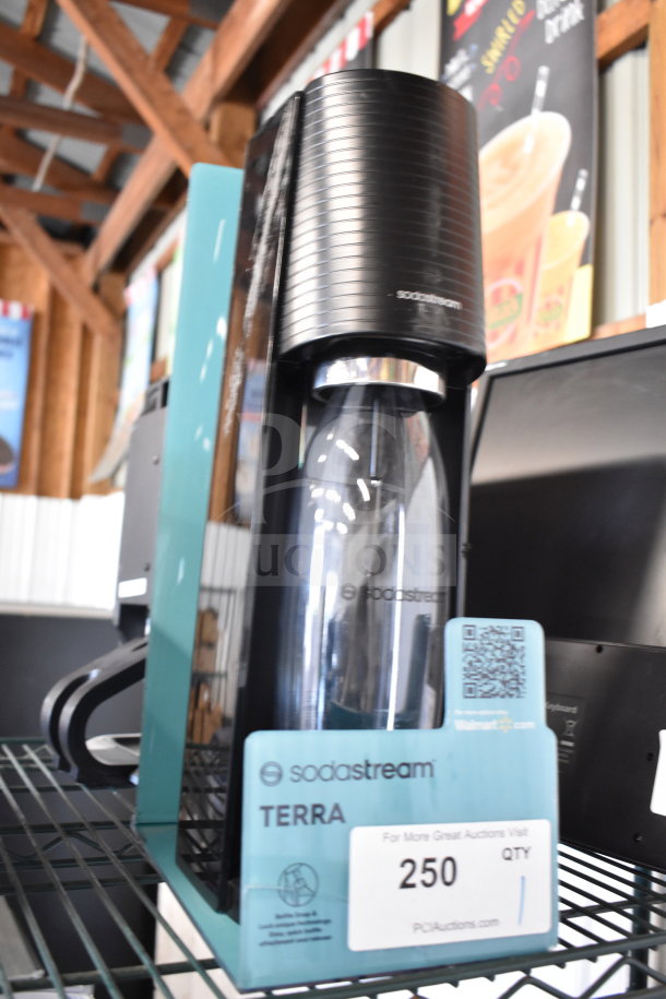 SodaStream Terra soda machine store display, black finish, model Terra, includes bottle, pristine condition, visible label.