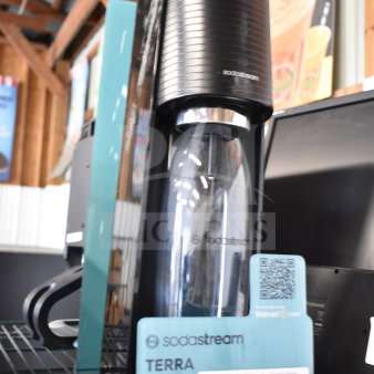 SodaStream Terra soda machine store display, black finish, model Terra, includes bottle, pristine condition, visible label.