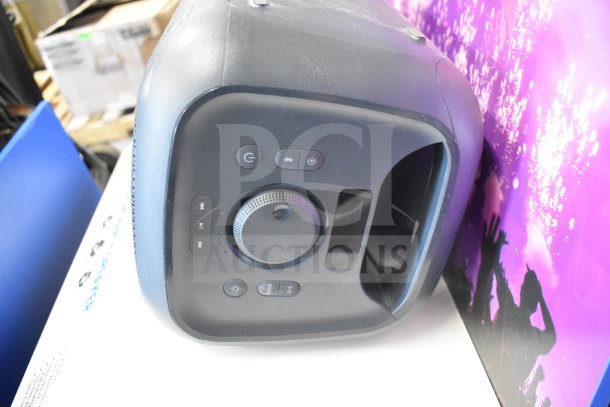 Onn Medium Party Speaker, black with control panel featuring power, volume, and playback buttons; good condition for store display.